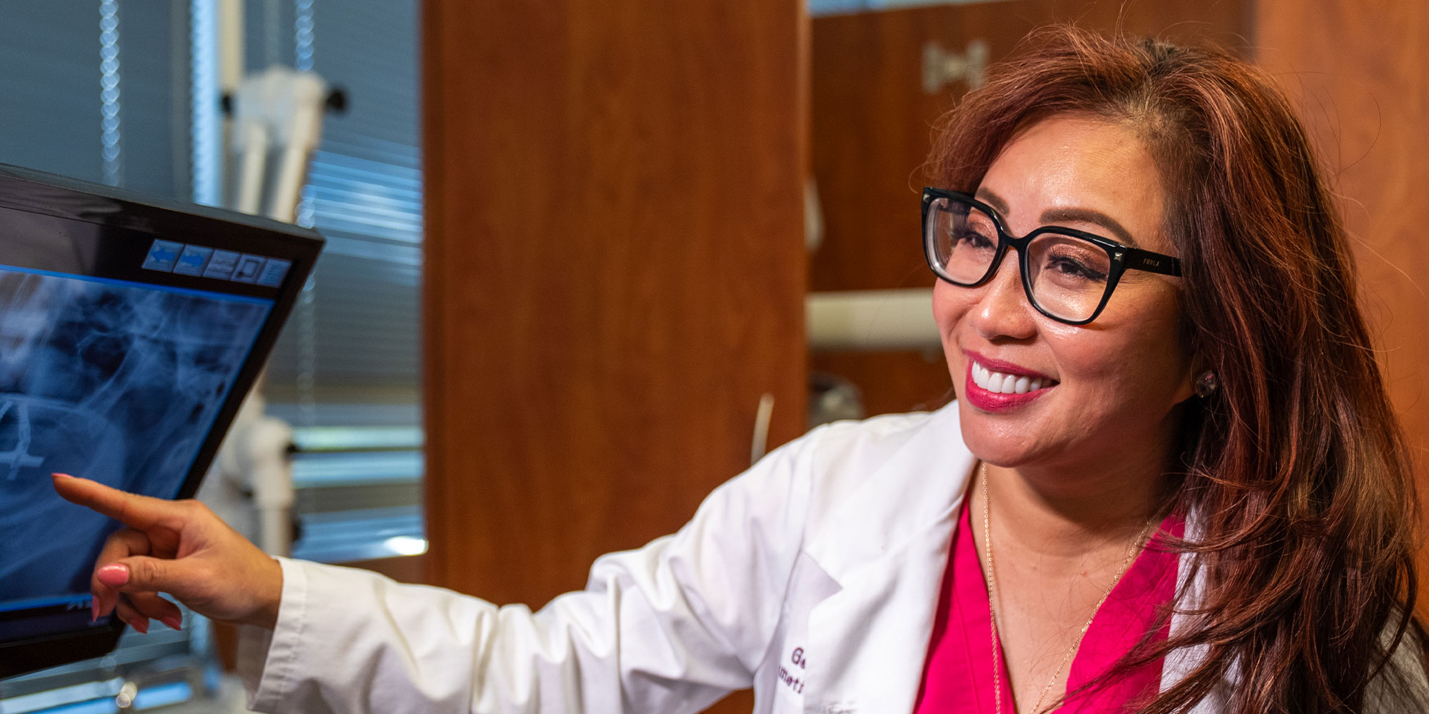 doctor showing dental procedure information to patient within the dental center