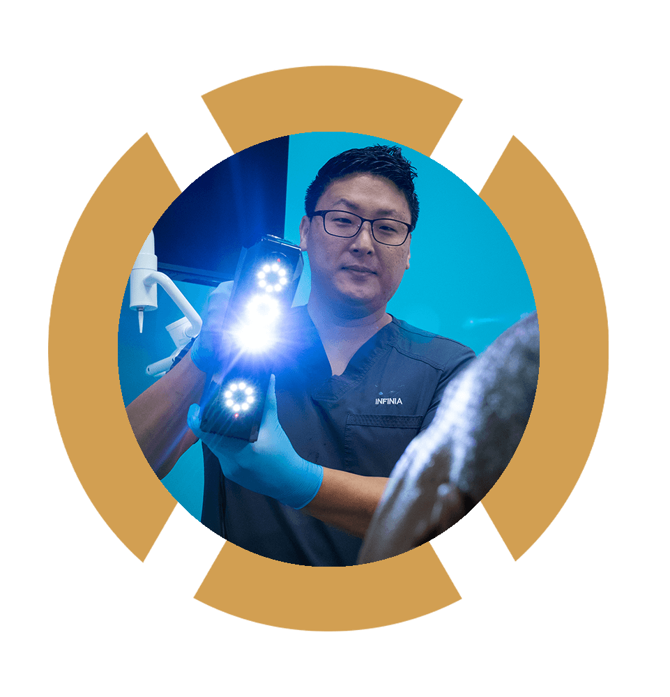 doctor using imaging device for dental procedure