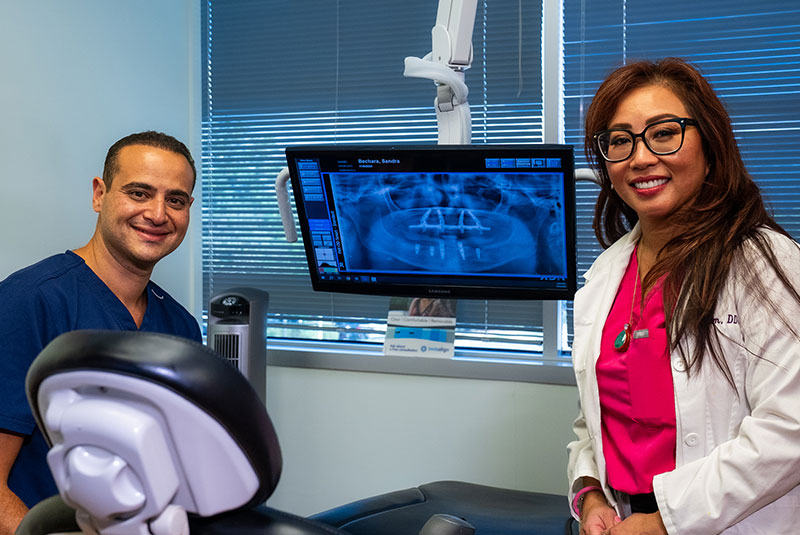 doctor smiling ready to treat patient for their procedure