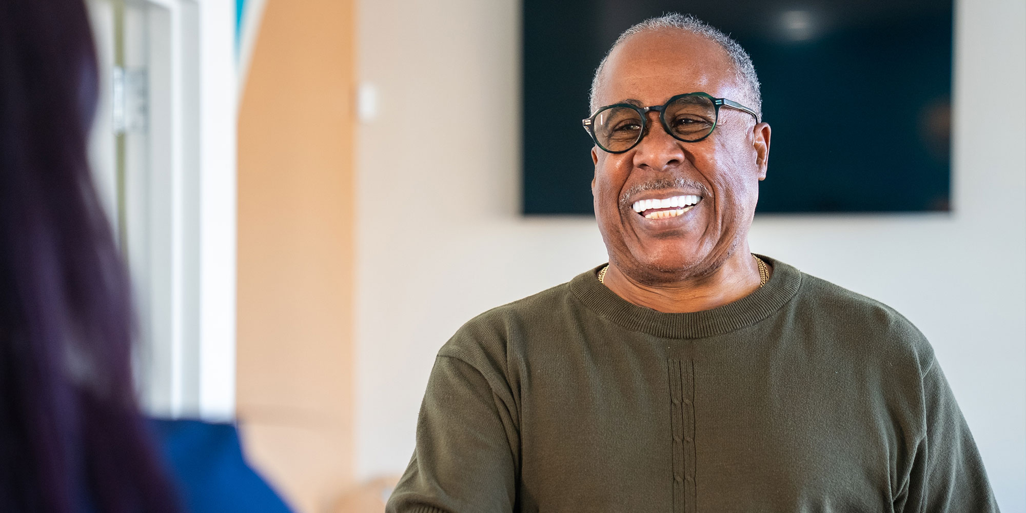 patient being helped at the front desk of the dental practice