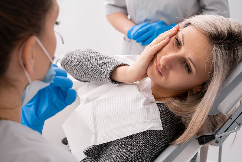 patient in the dental center complaining about mouth pain