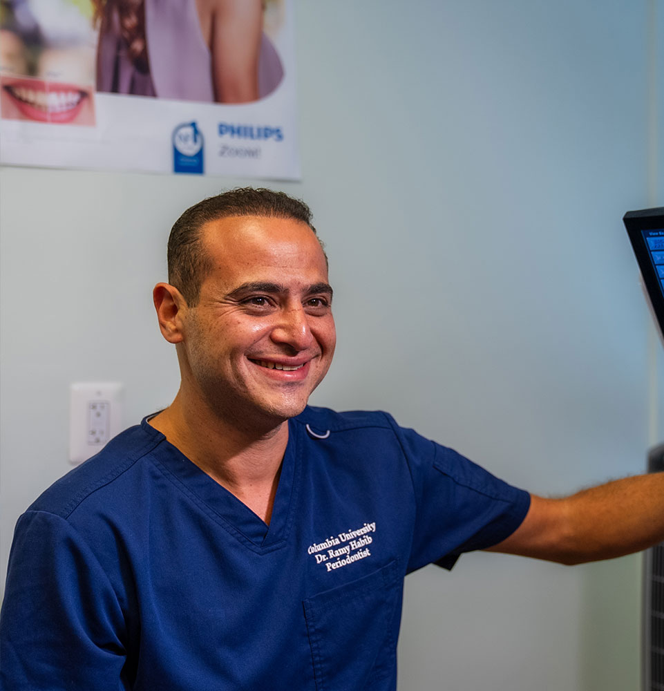 doctor going over dental procedure information with patient for their treatment