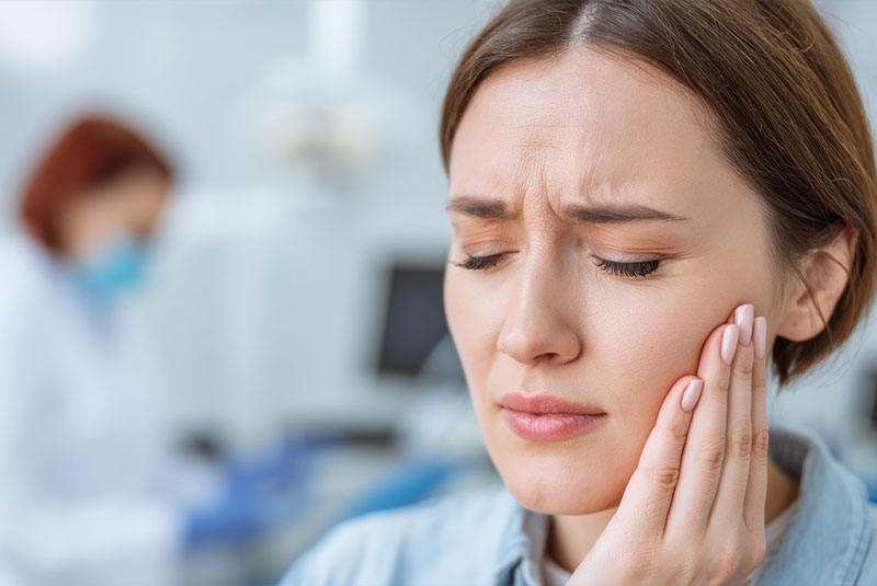 patient undergoing mouth pain while at the dental center