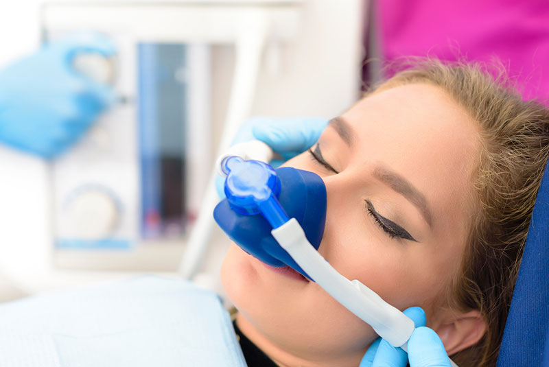 Patient relaxing in dental chair for IV sedation