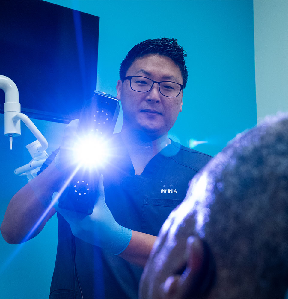 doctor examining patient for their dental treatment